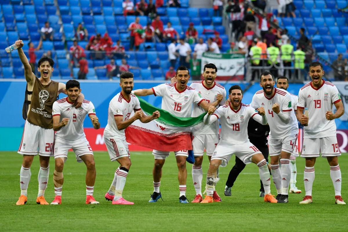 Iran's players celebrate at the end of the Russia 2018 World Cup Group B football match between Morocco and Iran at the Saint Petersburg Stadium in Saint Petersburg on June 15, 2018. (Photo by CHRISTOPHE SIMON / AFP) / RESTRICTED TO EDITORIAL USE - NO MOBILE PUSH ALERTS/DOWNLOADS        (Photo credit should read CHRISTOPHE SIMON/AFP/Getty Images)